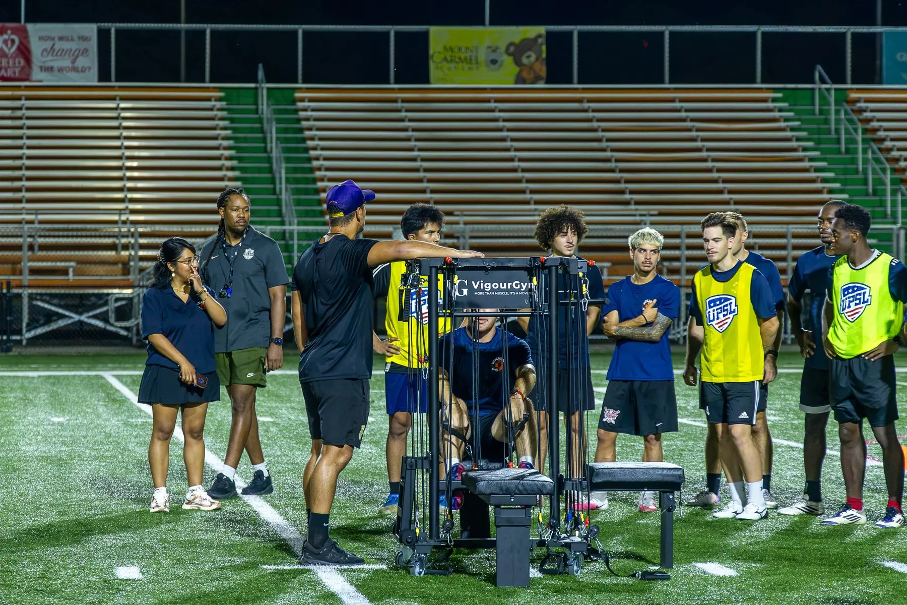 Coach explaining the VigourGym resistance system to a semi-professional soccer team